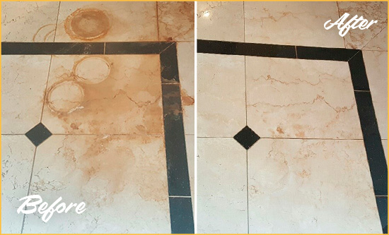 Before and After Picture of a Rainier Hard Surface Restoration Service on a Marble Floor to Eliminate Rust Stains